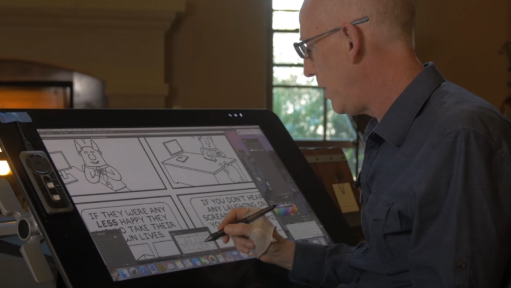 Scott Adams dibujando tira cómica