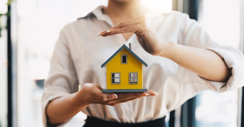 Casa miniatura manos